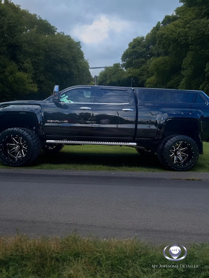 Black GMC Denali HD lifted tinted windows